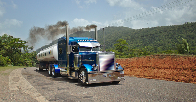 blue semi truck driving